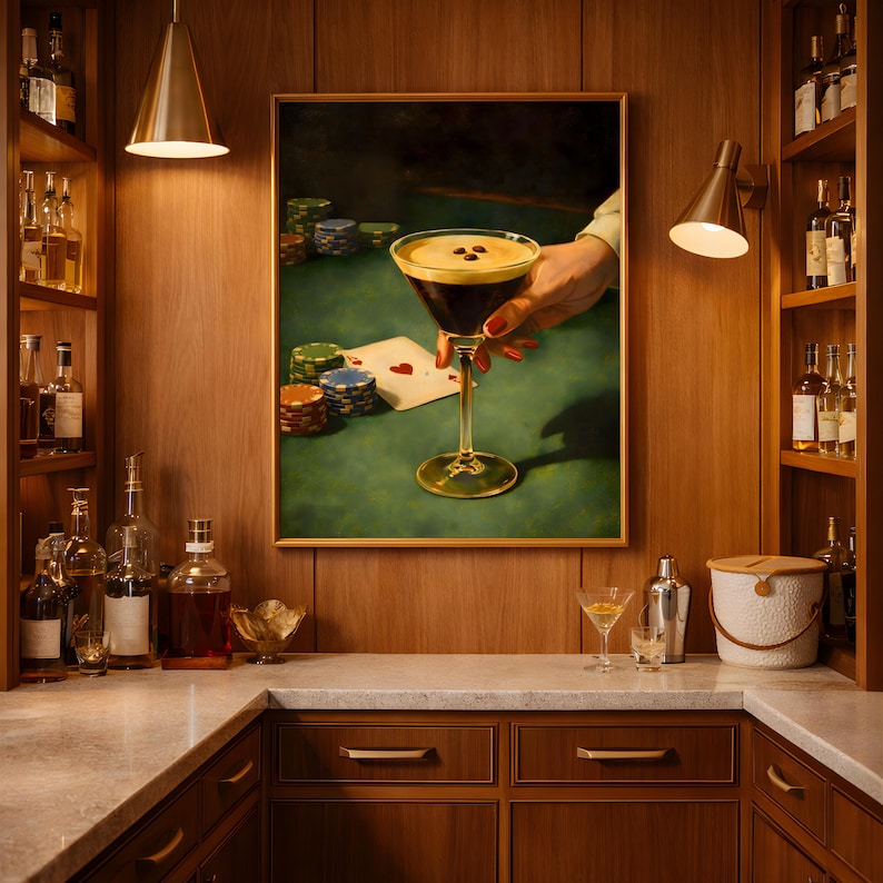 Vertical vintage martini print displayed in a luxury home bar area above a marble countertop, surrounded by liquor bottles and barware for a moody speakeasy decor and bar cart wall art aesthetic.