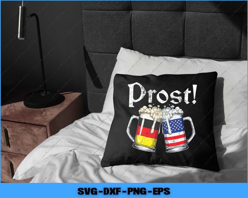 May include: Black throw pillow with the word "Prost!" in white, featuring two beer mugs clinking together. One mug has the German flag design, the other the American flag design. The pillow is on a white bed.