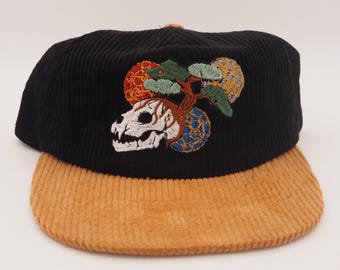 bonsai on the brain. Black corduroy adjustable hat with brown bill.
