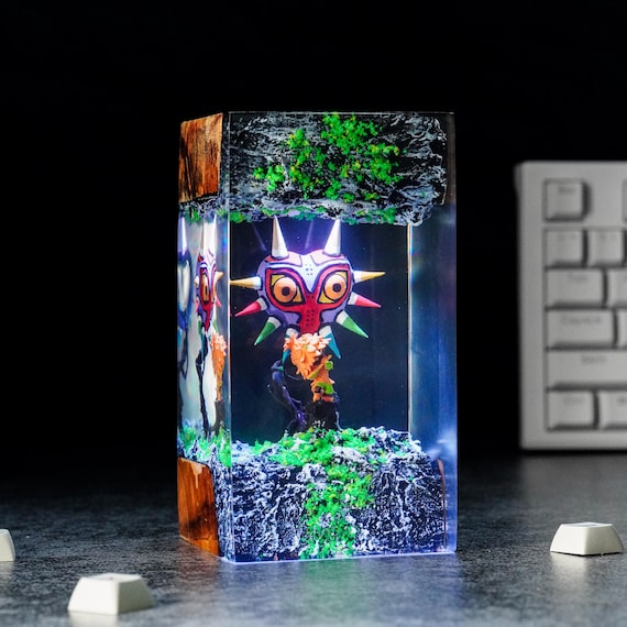 A Zelda-themed epoxy-resin-in-wood night light with 16 favorites — the kind of handmade gaming lamp that looks like it belongs in a shrine, not a big-box store.