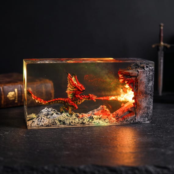 A hand-poured resin lamp sculpted into a fire dragon coiled around a glowing moon — the kind of piece that stops guests mid-sentence.
