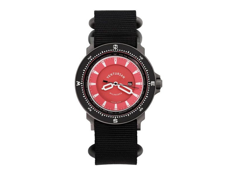 May include: A black and red Venturian watch with a black nylon strap. The watch face is red with white accents and the brand name. The watch has a date display and compass markings around the bezel.