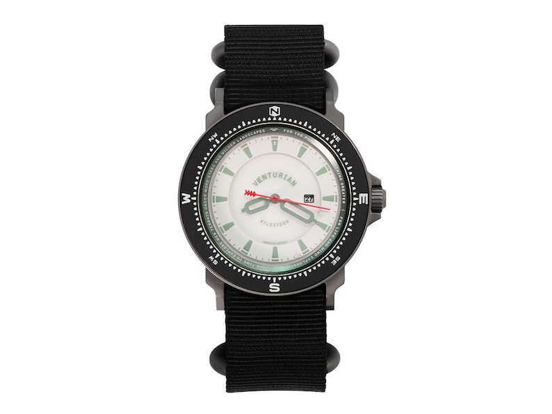 May include: A black and silver wristwatch with a white face, branded "Venturian". The watch has a black nylon strap and a red second hand. The watch face includes compass markings and a date display.