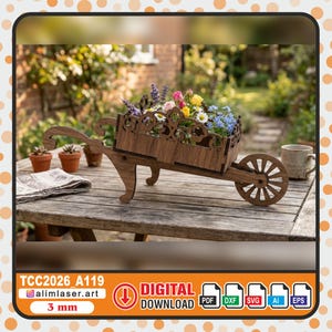 Puede incluir: Una jardinera de carretilla de madera llena de flores coloridas, incluyendo rosas rosas, flores amarillas y nomeolvides azules. La carretilla decorativa es de madera marrón y está sobre una mesa de madera. El texto "TCC2026_A119" y "Digital Download" son visibles.