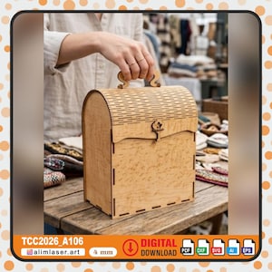 May include: A light-colored wooden chest with a curved top and handle. The chest has a decorative latch and is made of layered wood. The text "TCC2026_A106" and "4 mm" are visible. The chest is on a wooden table.