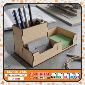 May include: A light-colored wooden desk organizer with a tall compartment for pens and pencils, a front slot holding grey business cards labeled Archicorp, and a side section containing a stack of light green sticky notes for office supplies.