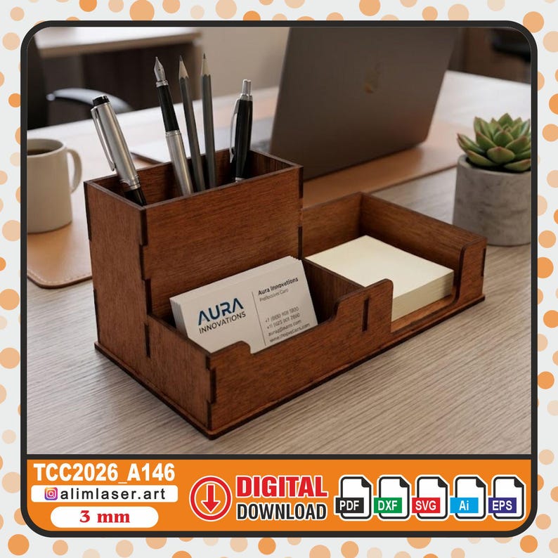 May include: A dark brown wooden desk organizer with a tall compartment for pens and pencils, and two lower sections for business cards and sticky notes. The business card features the text Aura Innovations. The organizer is made of 3 mm thick wood.