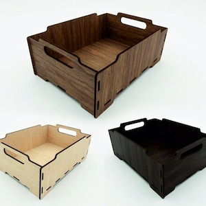 May include: Three rectangular wooden storage crates with open tops and integrated side handles. The crates feature a modular interlocking design with visible joints, available in light natural wood, medium brown wood, and dark brown wood finishes.