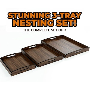 May include: A set of three rectangular nesting trays made of dark brown wood with visible grain. Each tray features integrated handles on the sides and box joint corners. The text STUNNING 3-TRAY NESTING SET! THE COMPLETE SET OF 3 is displayed.
