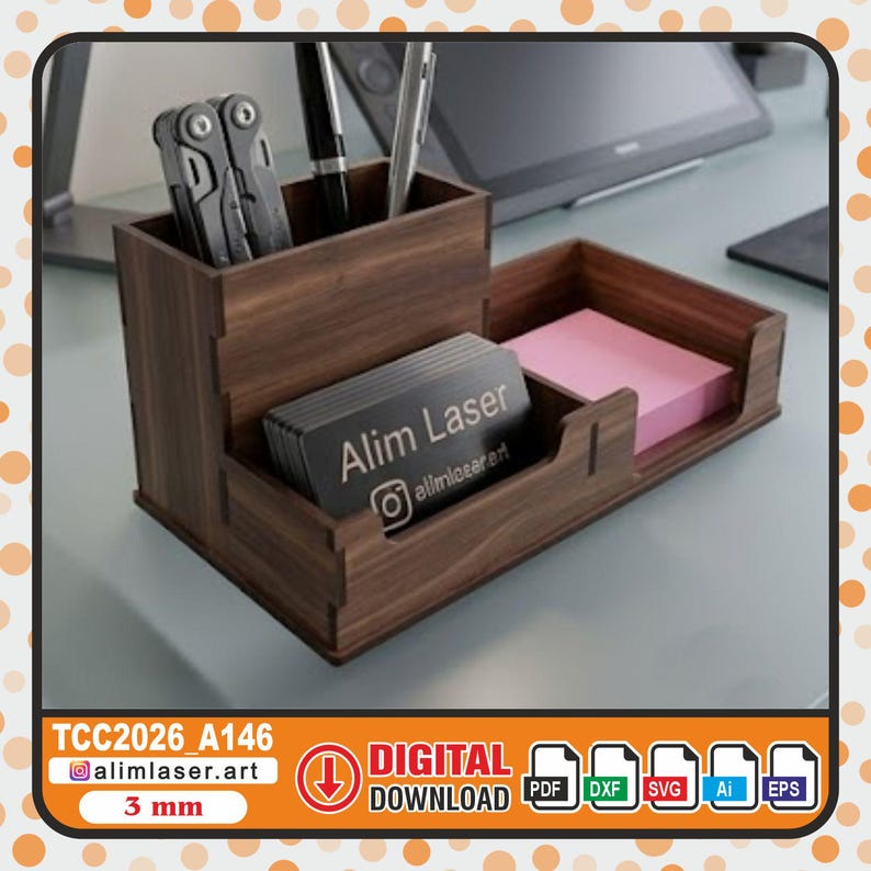 May include: A dark brown wooden desk organizer with a tall compartment for pens and tools, a front slot holding business cards labeled Alim Laser with an Instagram icon, and a side tray containing a stack of pink square sticky notes.