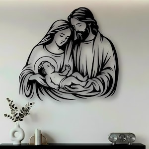 May include: A black metal wall art piece depicting a stylised illustration of a family unit consisting of two adults and an infant. The figures are rendered in a continuous line art style with bold black outlines against a plain background.