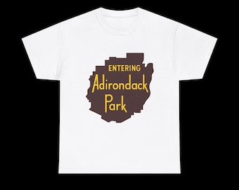 May include: White t-shirt with a brown and yellow graphic that reads "ENTERING Adirondack Park." The graphic is a stylized outline of a mountain range. The shirt is made of a soft, comfortable material.
