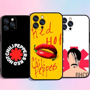 May include: Three phone cases with unique designs. One black case features a white logo with the text "Red Hot Chili Peppers". A yellow case displays a red chili pepper and the band's name. A white case has a band member illustration.