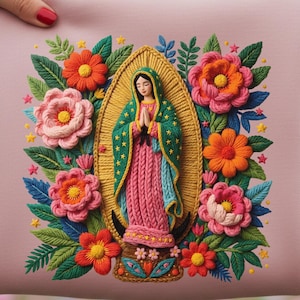 May include: A pink pillow with an embroidered design featuring the Virgin Mary surrounded by colorful flowers. The Virgin Mary is depicted with her hands clasped in prayer, wearing a green and pink robe.