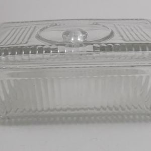 Vintage Refrigerator Dish, Clear Glass Refrigerator Dish, Ribbed with Top Knob, 8 3/4 x 5 x 3, a few rough spots on lip and lid