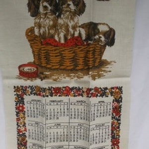 Vintage Dish Towel, Wheat Linen with a Basket Full of Puppies, Calendar Towel, 1973 Towel, 26 3/4x16, small stain