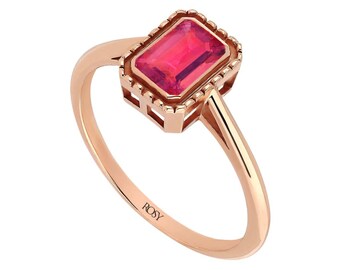 May include: Rose gold ring with a rectangular, bright pink gemstone. The gemstone is set in a detailed, square-shaped bezel. The ring band is smooth and slender, with the word "ROSY" engraved on the band.