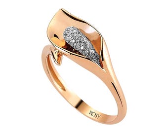 May include: Rose gold ring featuring a calla lily design. The lily's center is filled with small, sparkling stones. The ring has a smooth, polished finish and the word "ROSY" is engraved on the band.