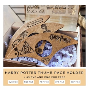 May include: Wooden Harry Potter thumb page holders with engraved designs, including the Platform 9 3/4 logo, a spiderweb, a silhouette, the Harry Potter logo, and other symbols. The holders are inside a wooden box with white paper.
