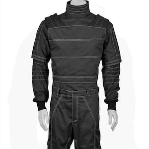 May include: Black racing suit with white stitching details. The suit features a high collar, long sleeves, and a belt at the waist. The design includes reinforced shoulder and arm panels, and the suit is displayed on a mannequin.