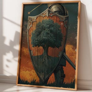 May include: Framed artwork showing a shield with a tree design, a knight's helmet, and a sword. The shield is brown with a green tree. The background has orange and yellow sunset colours. The artwork is in a wooden frame.