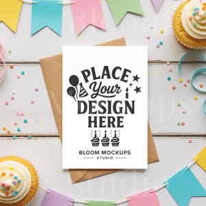 May include: A white card with the text "PLACE Your DESIGN HERE" in black, resting on a brown envelope. The card is surrounded by colorful party decorations, including cupcakes, confetti, and pennant banners. The text "BLOOM MOCKUPS STUDIO" is at the bottom.