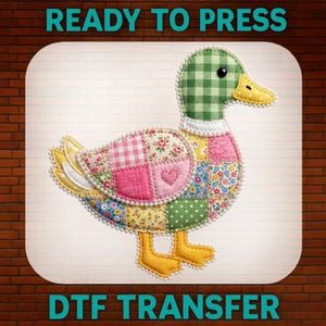 May include: A colorful, patchwork duck design with a green checkered head, yellow beak and feet, and a body composed of various floral and patterned fabrics. The text "READY TO PRESS" and "DTF TRANSFER" are displayed.