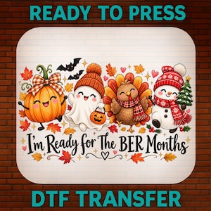 May include: A DTF transfer sheet featuring a cartoon pumpkin, a ghost in an orange beanie, a turkey in a plaid scarf, and a snowman with a Christmas tree. The text reads I'm Ready for The BER Months, surrounded by autumn leaves and small hearts.