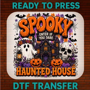 May include: A rectangular DTF transfer sheet featuring a Halloween design with the text SPOOKY ENTER IF YOU DARE HAUNTED HOUSE. The graphic includes a white ghost with a flower crown, a skull, two orange jack-o'-lanterns, and a dark mansion.