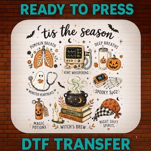 May include: A rectangular DTF transfer sheet featuring the text 'tis the season' and various Halloween-themed medical illustrations including lungs, a heart monitor, a pumpkin tumbler, a ghost with a stethoscope, a pulse oximeter, a cauldron on books, and a pumpkin oxygen tank.