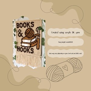 May include: A beige crochet wall hanging featuring the words "BOOKS & HOOKS" in brown. The design includes a yarn ball, books, and crochet hooks. The fringe at the bottom adds texture. The text "Created using acrylic DK yarn" is also visible.