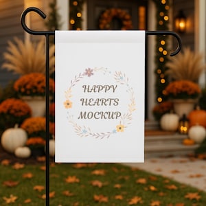 May include: A white garden flag featuring the text "HAPPY HEARTS MOCKUP" within a floral wreath. The flag is displayed outside, with pumpkins and autumn leaves visible in the background.