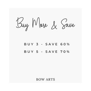 May include: White background with the text "Buy More & Save" in a cursive font. Below, it states "BUY 3 - SAVE 60%" and "BUY 5 - SAVE 70%". The text "BOW ARTS" is at the bottom.