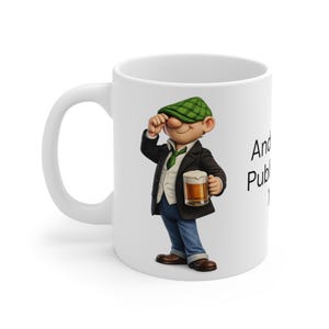 May include: A white ceramic mug featuring a cartoon character wearing a green plaid flat cap, a dark blazer, a white vest, and blue trousers. The character holds a glass of beer. The text "And" and "Pub" are printed in black on the side of the mug.
