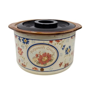 May include: A set of three ceramic mugs with a speckled, matte finish. The mugs are in shades of cream, light gray, and dark gray. Each mug has a simple, minimalist design and a rounded handle.