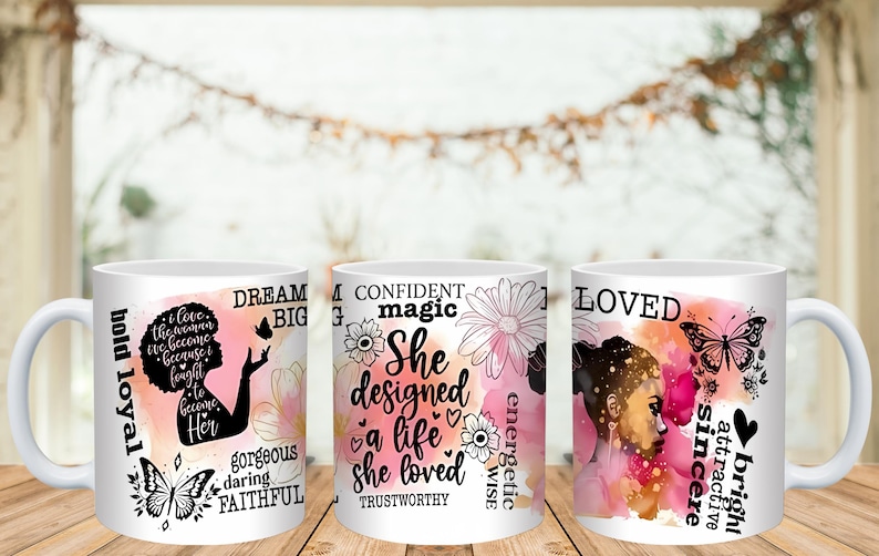 May include: Three white ceramic mugs with inspirational quotes and floral and butterfly designs. One mug features a silhouette of a woman with the words "Dream Big." Another mug has the words "She designed a life she loved." The third mug has the word "Loved."