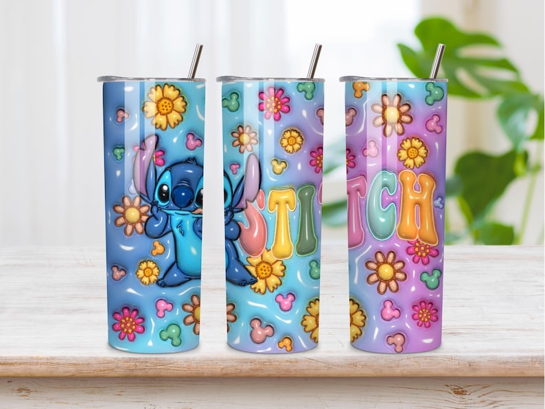 May include: A cylindrical stainless steel tumbler with a lid and straw, featuring a blue and purple gradient background decorated with yellow and pink flowers, small mouse-ear silhouettes, a blue alien character, and the word STITCH in colorful letters.