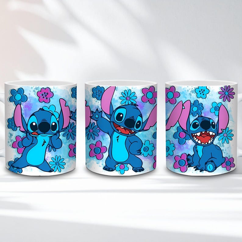 May include: Three white ceramic mugs featuring the character Stitch from Lilo & Stitch. Each mug has a different pose of Stitch, surrounded by blue and pink flowers against a blue watercolor background. The mugs are a fun and colorful item.