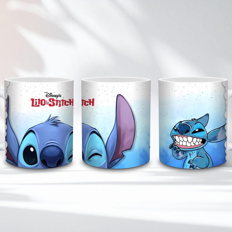 May include: White ceramic mug featuring the character Stitch from Disney's Lilo & Stitch. The mug has three different images of Stitch, with a blue and purple color scheme. The mug has the Disney's Lilo & Stitch logo.