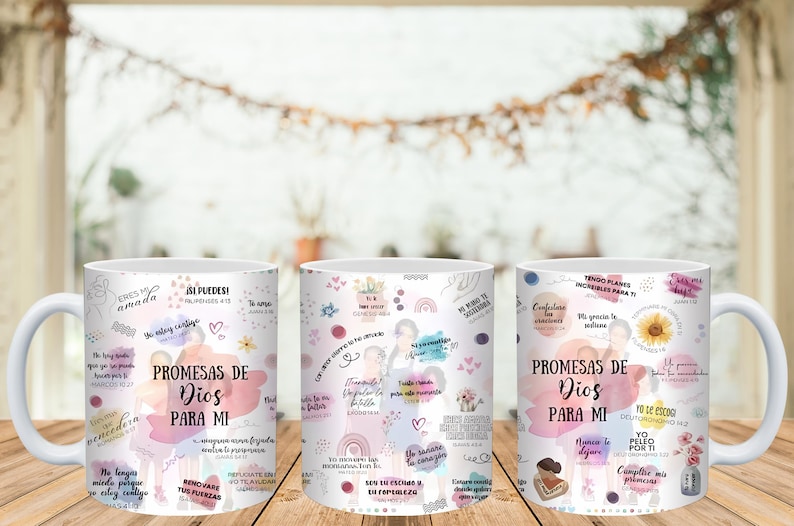 May include: White ceramic mugs with a wraparound design featuring the text "PROMESAS DE DIOS PARA MI" in Spanish, surrounded by inspirational quotes, floral accents, and watercolor-style graphics. The mugs are displayed on a wooden surface.