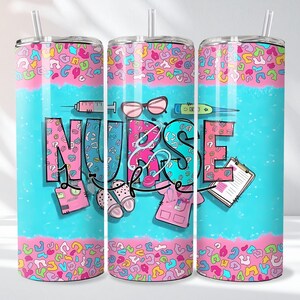 May include: A tumbler with a straw featuring the word "NURSE" in a colorful design. The design includes medical tools, shoes, and a pink and blue leopard print pattern. The tumbler is cylindrical and has a white straw.