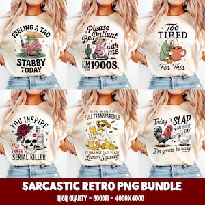 May include: A collection of six cream-colored t-shirts with humorous retro graphics. Designs include a frog with a knife, a woman on a scooter, a duck with a mug, a skull, a duck with lemons, and a rooster and duck. Text includes "Feeling a Tad Stabby Today".