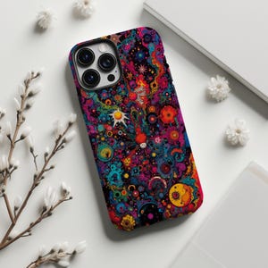 May include: A colorful phone case with a vibrant, abstract design featuring swirling patterns in shades of blue, red, yellow, and purple. The case has a glossy finish and a black camera cutout.