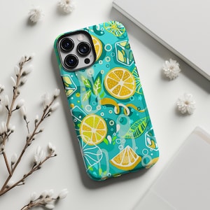 May include: A smartphone case featuring a vibrant teal background with a repeating pattern of yellow lemon slices, green leaves, and translucent blue ice cubes. The design includes white circular bubbles and stylized citrus peel accents.