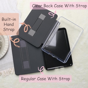 May include: A set of tablet cases, including a clear back case and a regular case with a strap. The regular case is dark gray with a built-in hand strap. The clear case is transparent. Text on the image reads "Clear Back Case With Strap" and "Regular Case With Strap."