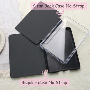 May include: A black tablet case with a clear back case, and the text "Clear Back Case No Strap" and "Regular Case No Strap". The case is open, revealing the interior. The background is a light, textured surface.