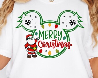 May include: White t-shirt featuring a green Mickey Mouse-shaped design with Christmas elements. The design includes a Santa Claus illustration, snowflakes, and the text "MERRY Christmas" in red and green.
