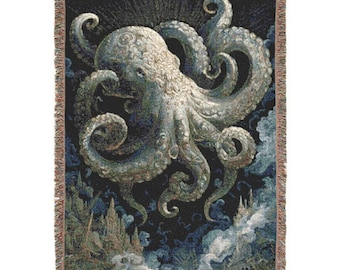 May include: A woven throw blanket with a detailed illustration of a large octopus against a dark blue backdrop. The octopus is mainly white and grey, with blue and green accents. The blanket has a fringed edge and depicts a fantasy scene.