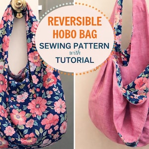 May include: Reversible hobo bag sewing pattern with tutorial. One side features a navy blue floral print with pink flowers, the other side is a solid pink fabric with floral trim. The bag is hanging from a door knob.