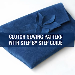May include: A navy blue clutch with a flower accent. The clutch is made of a soft material and has a folded flap closure. Text on the image reads: CLUTCH SEWING PATTERN WITH STEP BY STEP GUIDE.